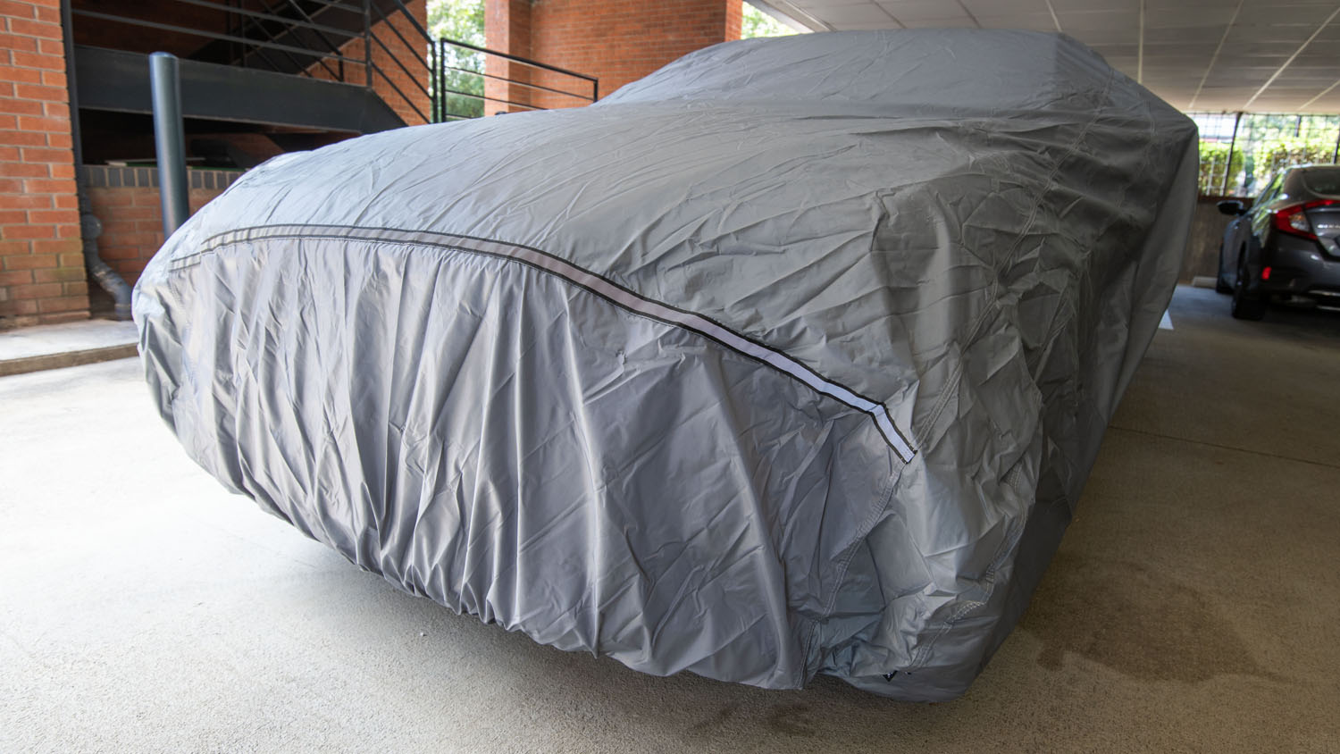 Tour Performance Car Cover installed on a testing vehicle.
