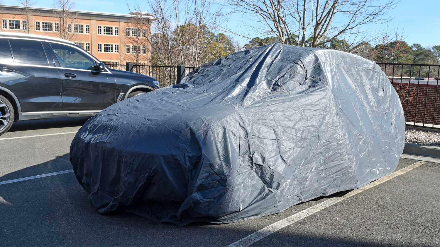 The OxGord Executive Storm-Proof car cover installed on a testing vehicle.